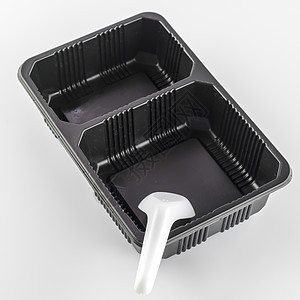 带勺子的黑色托盘包装食物生活塑料产品泡沫苯酚金属盒子黄色图片