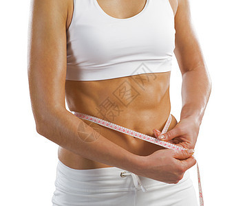 腰部的年轻运动女性训练测量橘皮营养磁带健身房腰围皮肤身体女孩图片