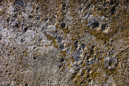 灰色混凝土表面风化石膏石墙建筑石头地面杂草裂缝岩石材料图片