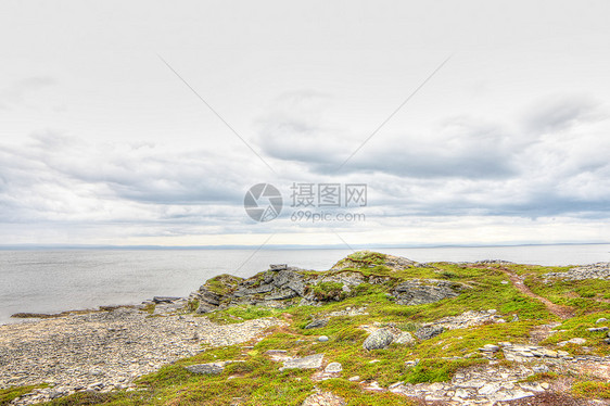 挪威北部地貌景观场景海岸线地平线支撑草地海洋反射海滩石头苔藓图片