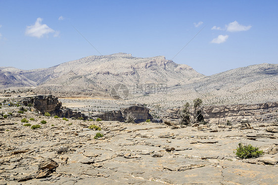 Jebel 广场景观旅游地质学骨折冒险丘陵峡谷荒野探索沙漠天空图片