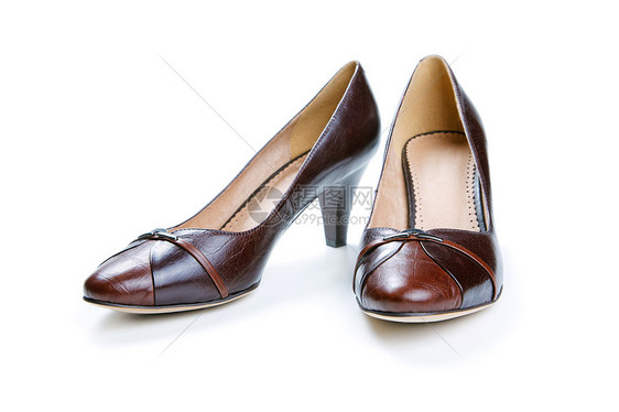 白色背景孤立的棕色女性鞋子高跟鞋齿轮脚跟皮革女士衣服图片