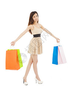 带购物袋的美丽年轻女子裙子礼物购物者女孩头发乐趣成人微笑顾客展示图片