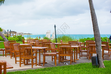 加勒比热带海滩的外门咖啡馆民众后院长椅奢华咖啡店瓶子扶手椅海景木头海滩图片