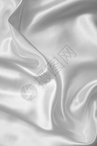 平滑优雅的白色丝绸折痕涟漪纺织品银色新娘布料织物材料投标婚礼图片
