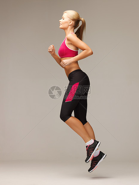 运动妇女跑步或跳跃运动装优胜者训练护理力量运动员重量精力身体女性图片