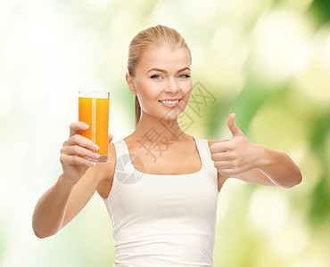 女人拿着橙汁杯子衬衫水果果汁微笑快乐饮食橙子身体女性玻璃图片