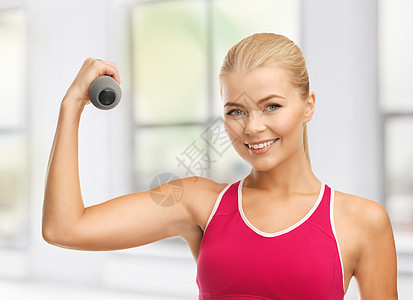 年轻运动女青年 有轻聋哑铃培训师身体力量教练健康损失饮食运动装训练重量图片