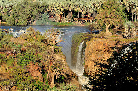 安哥拉和纳米比亚边界的Epupa瀑布巨石彩虹岩石棕榈急流悬崖戏剧性科兰苦烯洪水图片