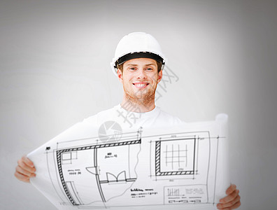 戴有蓝图头盔的男建筑师房间项目设计师技术员微笑方案工作承包商工程师工人图片