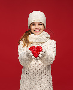 穿着小红心冬衣的女童青春期帮助帽子孩子们快乐保健微笑机构手套孩子图片