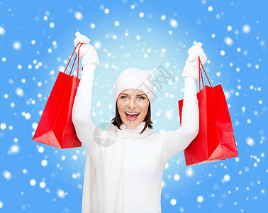 幸福的女士用购物袋的照片消费者礼物购物销售女性购物中心雪花购物者开支享受图片