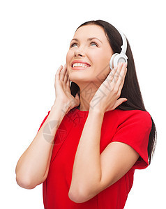 带着耳机的微笑着的妇女手机女性成人音乐播放器享受幸福女孩音乐打碟机热情图片