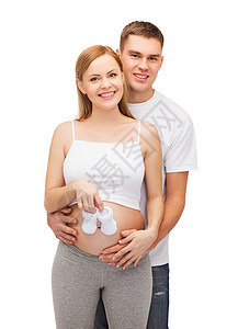 幸福的年轻家庭预产期子女怀孕女孩礼物丈夫父母靴子肚子新生腹部母性图片