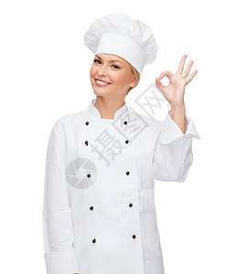 微笑的女厨师露出OK手牌手势帽子成功美食职业女士工作面包食物服务图片