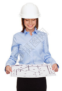 戴头盔的女商务人士 看着蓝图工程师企业家建筑师建设者建筑绘画开发商项目工作人士图片