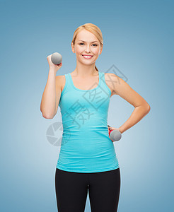 年轻运动女青年 有轻聋哑铃肌肉运动员减肥训练健康蓝色力量激光二头肌身体图片