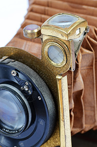 古董相机幅面黄铜镜子摄影皮革背景图片