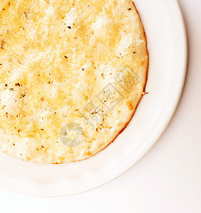 带奶酪的坑a棕色绿色小吃蛋糕饼子盘子食物洋葱白色早餐图片