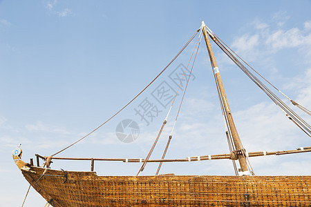 Dhau 阿曼传统白色村庄手工码头天空海洋钓鱼历史木头图片