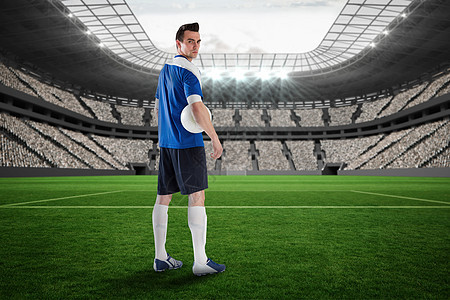 穿蓝球衣的英俊足球运动员支持者活动齿轮运动扇子数字运动服男人计算机人群图片