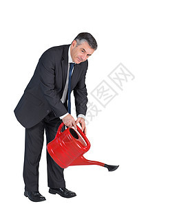 成熟的商务人士用红色罐子浇水衬衫商务专注职业头发领带喷壶生长夹克套装图片
