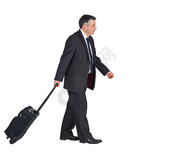 成熟的商务人士拉着他的手提箱夹克领带衬衫旅行游客人士专注商业公司头发图片