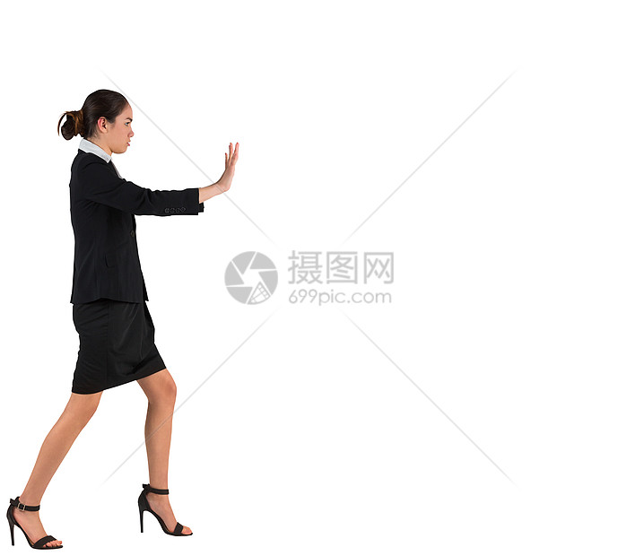 商业女商务人士站立和推动专注混血高跟鞋裙子公司双手职业女性手势商务图片