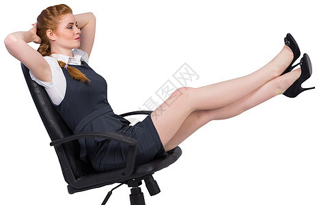 女商务人士坐在摇摇椅上图片