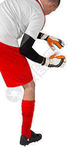 红白的守门员准备接球齿轮运动服男人播放器红色男性活动运动运动员足球图片