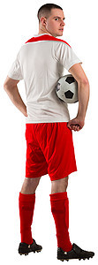 足球运动员握着球播放器运动服活动白色男人男性齿轮红色运动图片