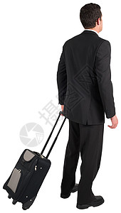 青年商务人士拉他的行李箱人士男人手提箱游客男性行李商业旅行商务职业背景图片