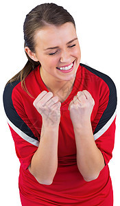 红欢呼的足球球迷兴奋欣快感优胜者红色快乐运动球衣支持者欢呼杯子扇子图片