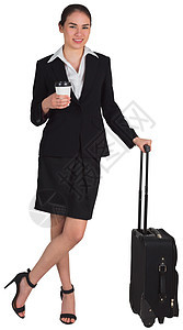 女商务人士靠着她拿着咖啡的手提箱图片