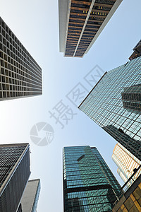 摩天大楼低角度视图金融商业建筑反射阳光办公楼城市房地产住宅区市中心图片