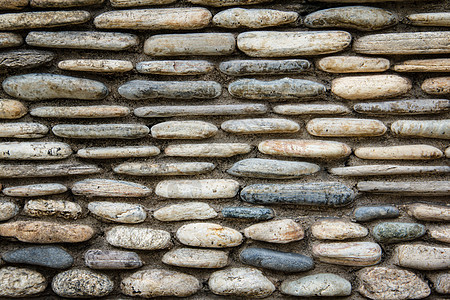 有水泥的石墙面边界建筑学石墙棕色彩石石头水平鹅卵石岩石材料图片