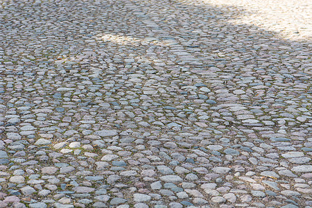 旧可腐石头背景建筑学岩石材料地面街道路面灰色鹅卵石花岗岩人行道图片