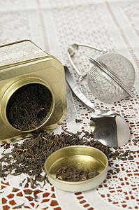 金属制成有机黑茶饮料绑定叶子花瓣香气茶匙圆形草本仪式绿色图片