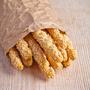 手工艺品袋中含芝麻种子的Grissini面包棒美味乡村盐渍饼干面包食物营养食品小吃美食图片