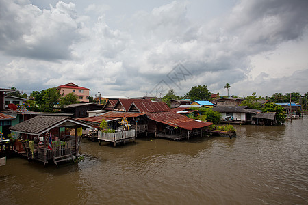 泰国的内船市场日落森林城市旅行船屋商业房屋太阳运河图片