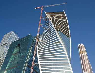 办公大楼的建筑建造工程蓝色摩天大楼商业建筑学技术机器天空建筑物工业生长图片