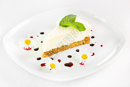 芝士蛋糕甜点派对雏菊花花朵餐厅糕点奶油叶子美食滴水盘子图片