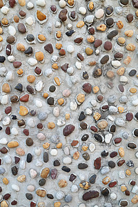 混凝土壁纹理中的插图花园圆形棕色地面海滩碎石巨石石头团体材料图片