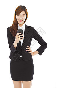 年轻漂亮的商业女商务人士触摸智能电话倾斜人士工人微笑女性女士成人技术老板快乐图片