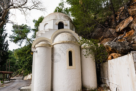 波罗斯岛希腊正统教会传统教堂圆顶旅游树木目的地旅行白色假期信仰图片