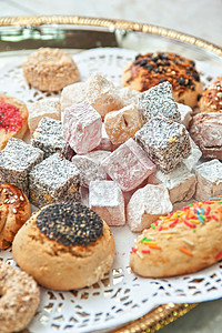 土耳其喜悦的甜点面团脚凳咖啡店盘子蜜饼开心果蜂蜜核桃坚果美食图片