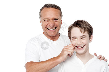 父亲和儿子在玩耍 捏着脸颊图片