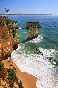 葡萄牙阿尔加韦地区拉各斯花朵海景海岸编队悬崖海浪地形假期地标海岸线图片