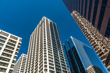 摩天大楼景观日落建筑城市蓝色公司办公室天际天空树木图片
