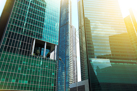 现代摩天大楼城市蓝色工作阳光中心场景金融建筑学景观职场图片